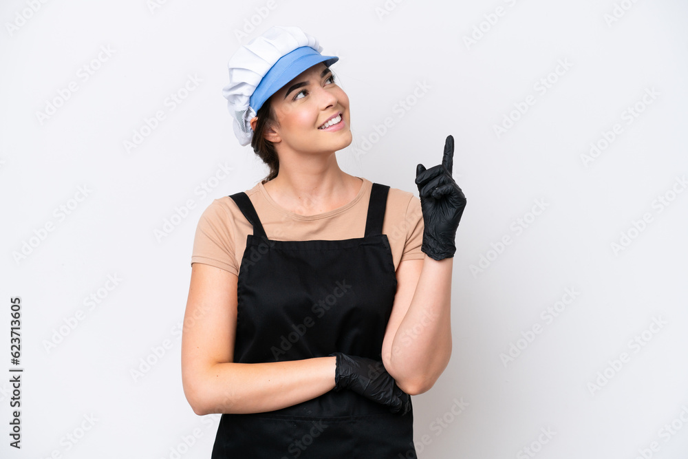 Fishmonger brazilian woman wearing an apron isolated on white background pointing up a great idea Fishmonger brazilian woman wearing an apron isolated on white background pointing up a great idea