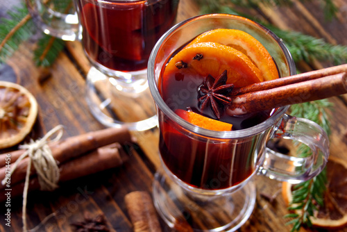 Christmas mulled wine with cinnamon sticks, orange and anise
