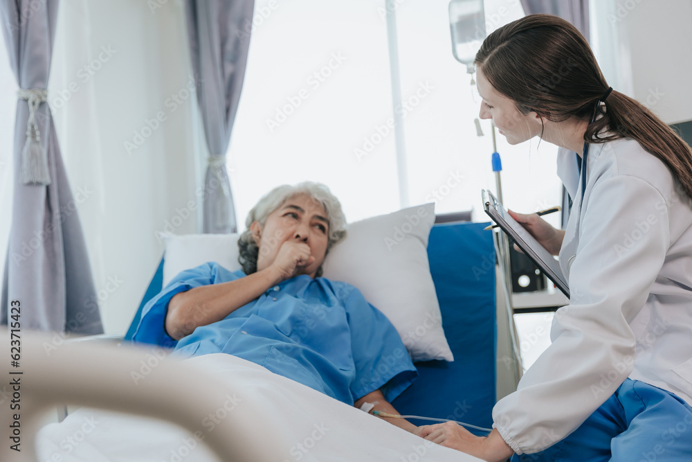 Friendly professional female doctor meeting an elderly patient on a hospital bed the concept of caring for the elderly. Friendly professional female doctor meeting an elderly patient on a hospital bed the concept of caring for the elderly.