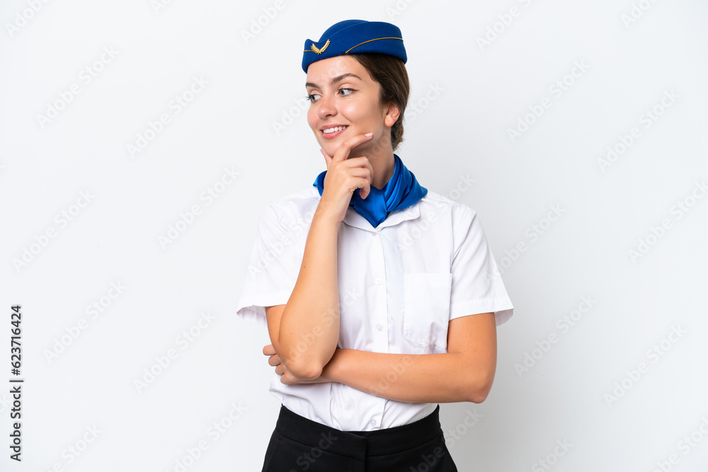 Airplane stewardess caucasian woman isolated on white background looking to the side Airplane stewardess caucasian woman isolated on white background looking to the side
