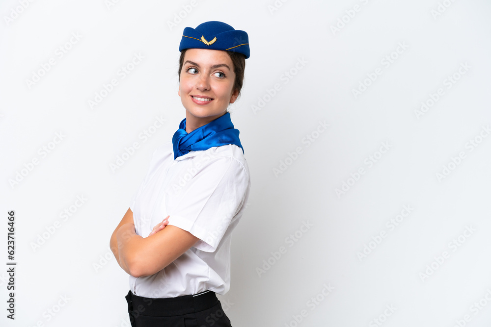 Airplane stewardess caucasian woman isolated on white background with arms crossed and happy Airplane stewardess caucasian woman isolated on white background with arms crossed and happy