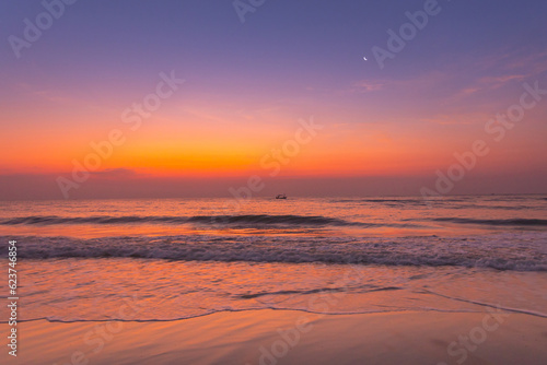 A beautiful sunset and sea sand beach
