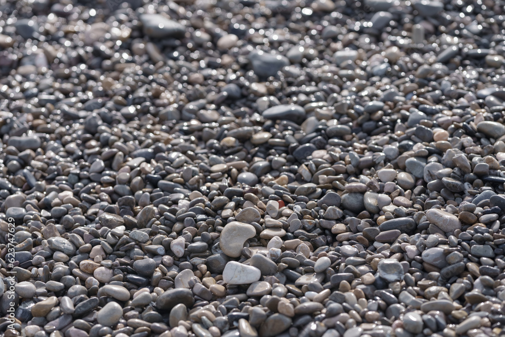 Wet pebbles on a mediterranean shore beach Wet pebbles on a mediterranean shore beach
