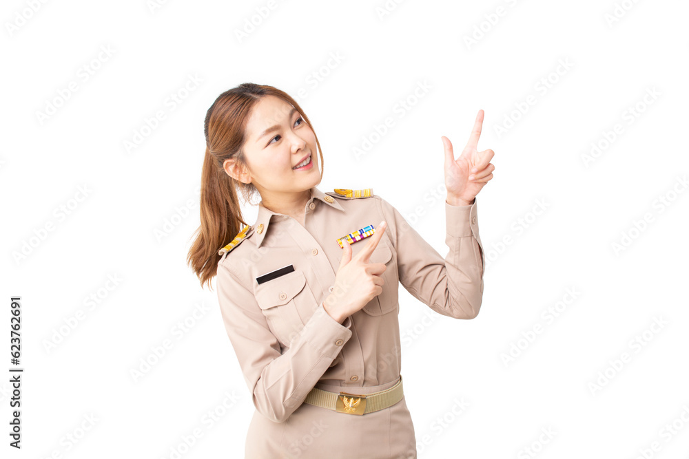 Female Thai government officer in khaki uniforms looking above and pointing up to product or empty copy space isolated white background. advertising, presenting, promotion, satisfied product concept. Female Thai government officer in khaki uniforms looking above and pointing up to product or empty copy space isolated white background. advertising, presenting, promotion, satisfied product concept.