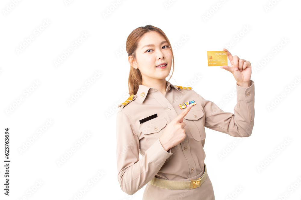 Female Thai government officer in khaki uniforms smiling and pointing on white background. Asian woman holding credit card for transaction money. Concept of advertising, payment purchase, financial. Female Thai government officer in khaki uniforms smiling and pointing on white background. Asian woman holding credit card for transaction money. Concept of advertising, payment purchase, financial.