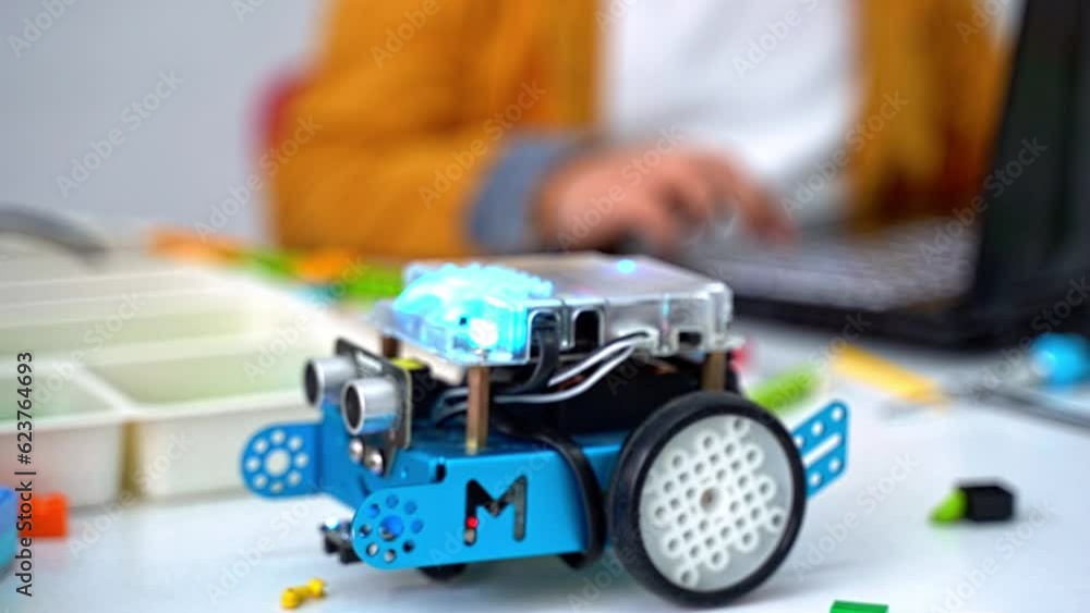 Robotics programming class. Children construct Mbot and code Robot ...