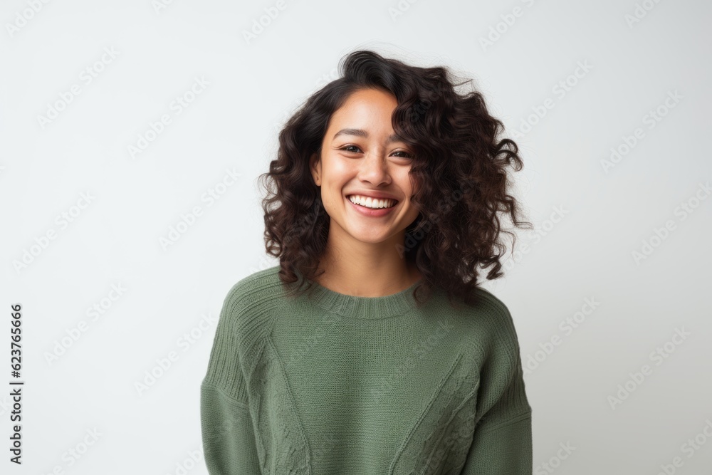 Portrait of a smiling young woman with curly hair over white background Portrait of a smiling young woman with curly hair over white background