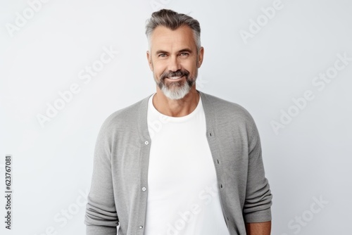 Portrait of handsome mature man in casual clothes looking at camera.