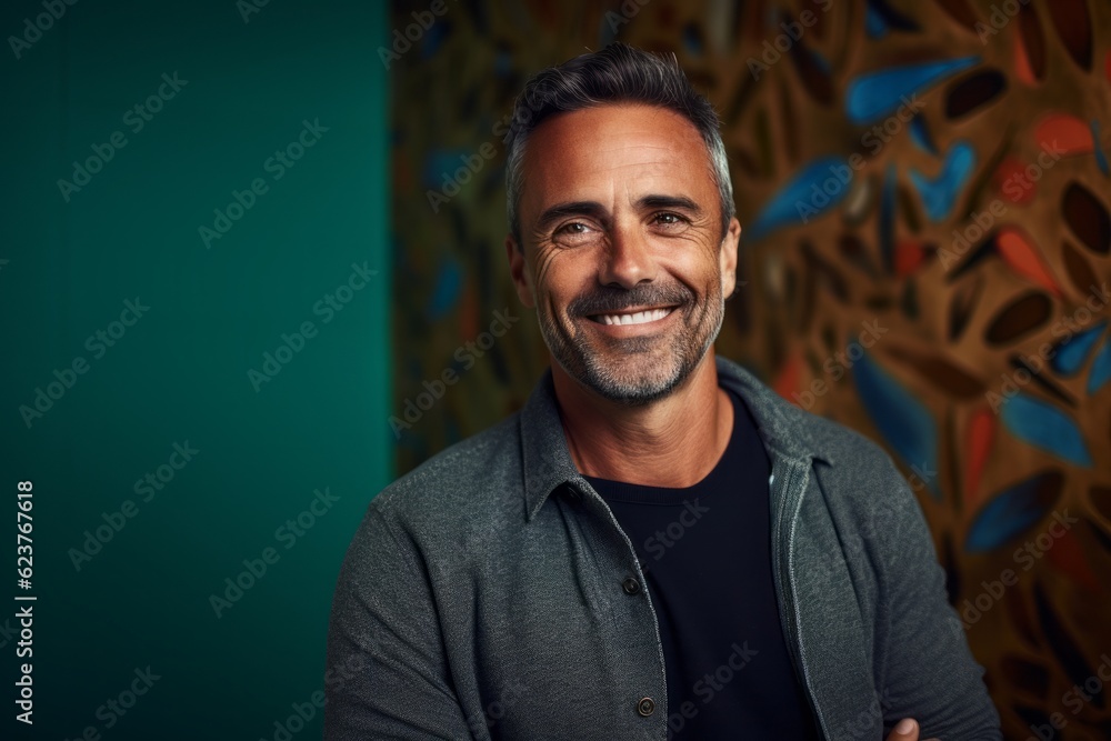 Portrait of a handsome middle-aged man smiling in a studio. Portrait of a handsome middle-aged man smiling in a studio.