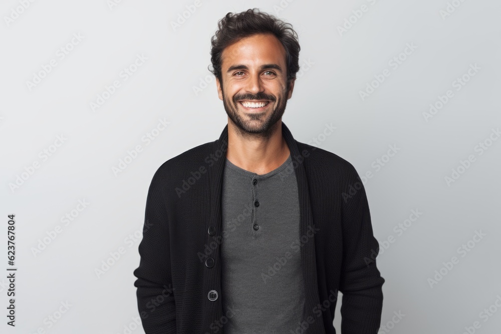 Portrait of a handsome young man smiling and looking at camera isolated over white background Portrait of a handsome young man smiling and looking at camera isolated over white background