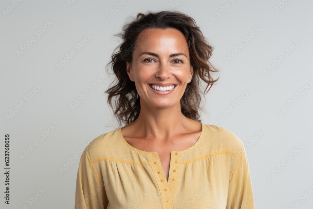 Portrait of a beautiful woman smiling at the camera isolated on a white background Portrait of a beautiful woman smiling at the camera isolated on a white background