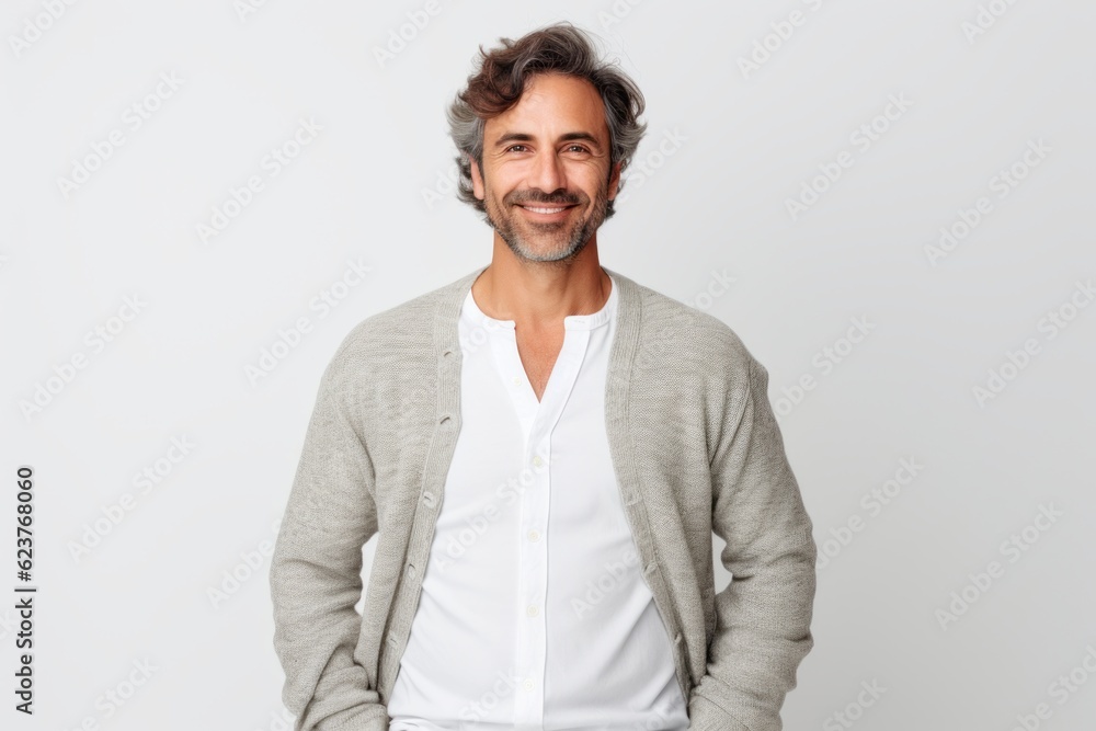 Portrait of a handsome man standing with hands in pockets over white background Portrait of a handsome man standing with hands in pockets over white background
