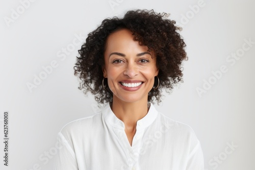 Portrait of a beautiful young african american woman smiling at camera over white background