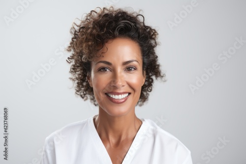 Portrait of a smiling young african american woman isolated on a white background