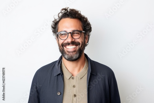 Portrait of a handsome young man wearing glasses and smiling at the camera © Robert MEYNER