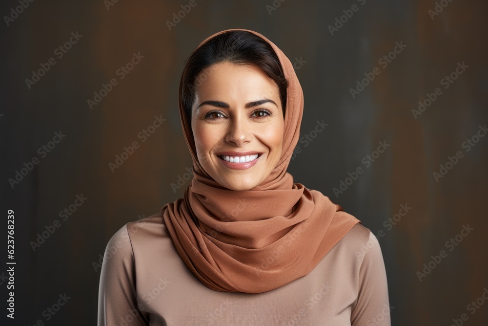 Portrait of beautiful young muslim woman with hijab on dark background Portrait of beautiful young muslim woman with hijab on dark background