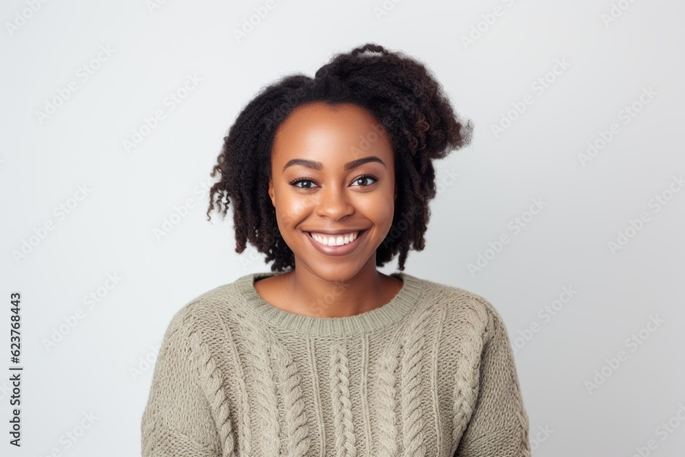 Portrait of a smiling african american woman standing against white background Portrait of a smiling african american woman standing against white background