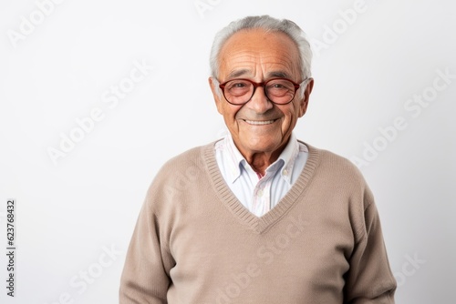 Portrait of a happy senior man with eyeglasses on white background