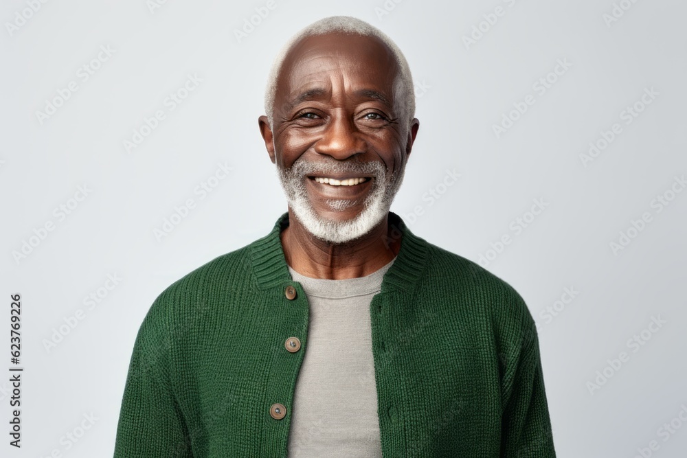 Portrait of a smiling senior African American man standing against white background Portrait of a smiling senior African American man standing against white background