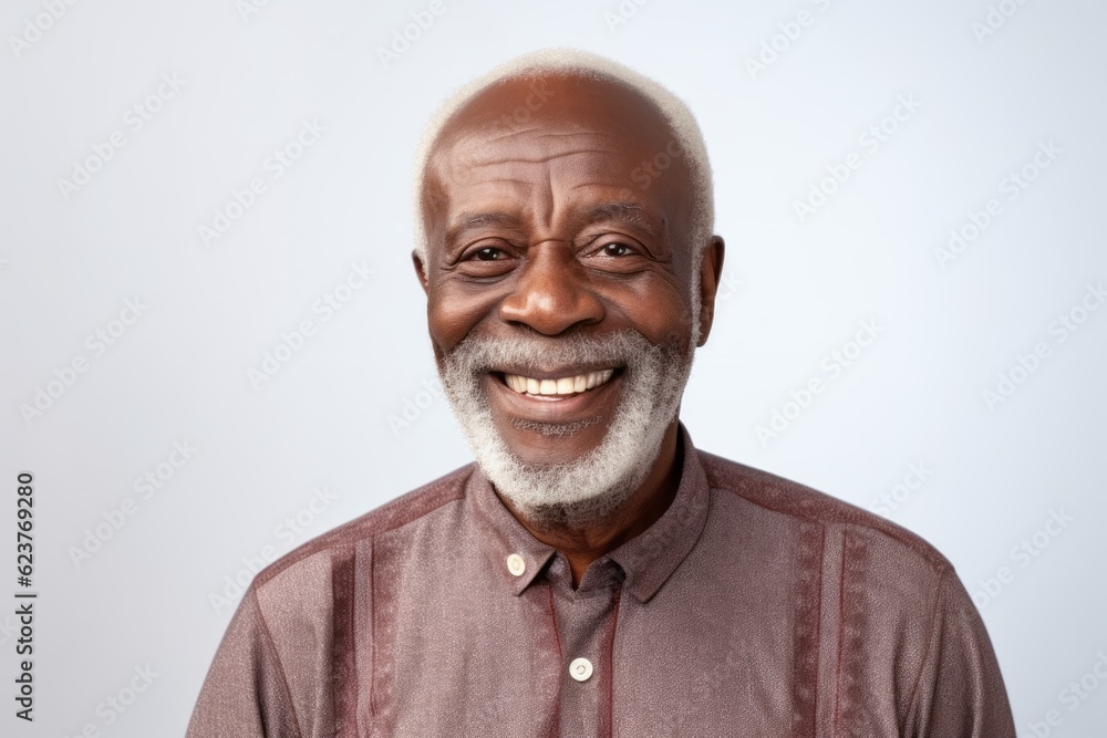 Portrait of a senior African American man smiling at the camera. Isolated on white background. Portrait of a senior African American man smiling at the camera. Isolated on white background.