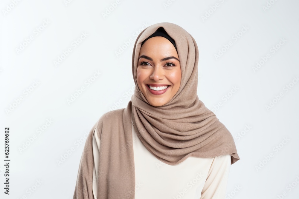 Portrait of a smiling muslim woman in hijab isolated on a white background Portrait of a smiling muslim woman in hijab isolated on a white background