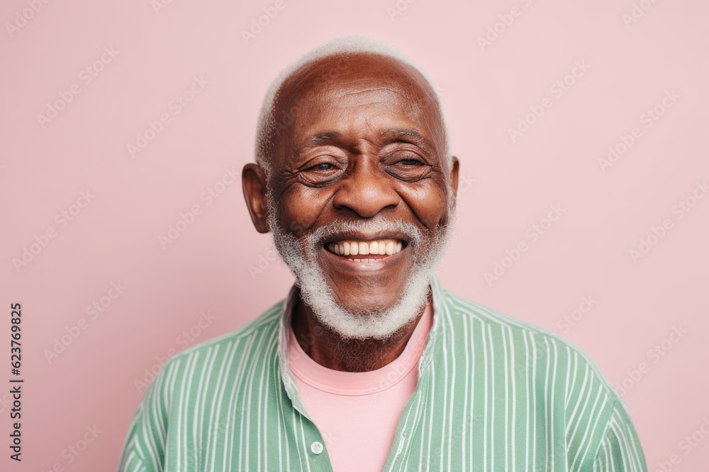 Close up portrait of a smiling senior man looking at camera isolated over pink background Close up portrait of a smiling senior man looking at camera isolated over pink background