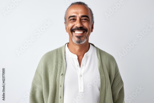 Portrait of a smiling Indian man looking at camera isolated on a white background