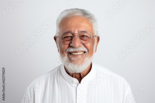 Portrait of happy senior asian man in white shirt and glasses © Robert MEYNER