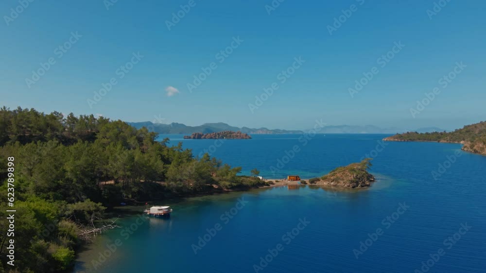 Aerial view beautiful cozy place for wild camping with cars and vans on coast of mediterranean sea in Turkey. van tourism summertime seaside travel vacation. secluded beach on island shore Aerial view beautiful cozy place for wild camping with cars and vans on coast of mediterranean sea in Turkey. van tourism summertime seaside travel vacation. secluded beach on island shore