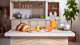 Interior of small white kitchen with fresh fruit, two glasses of orange juice, baguette, red caviar, croissant and cookies with chocolate chips on the table. Generative AI
