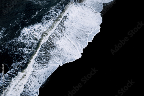 Aerial Photography of Waves crashing on a black sand beach in Iceland