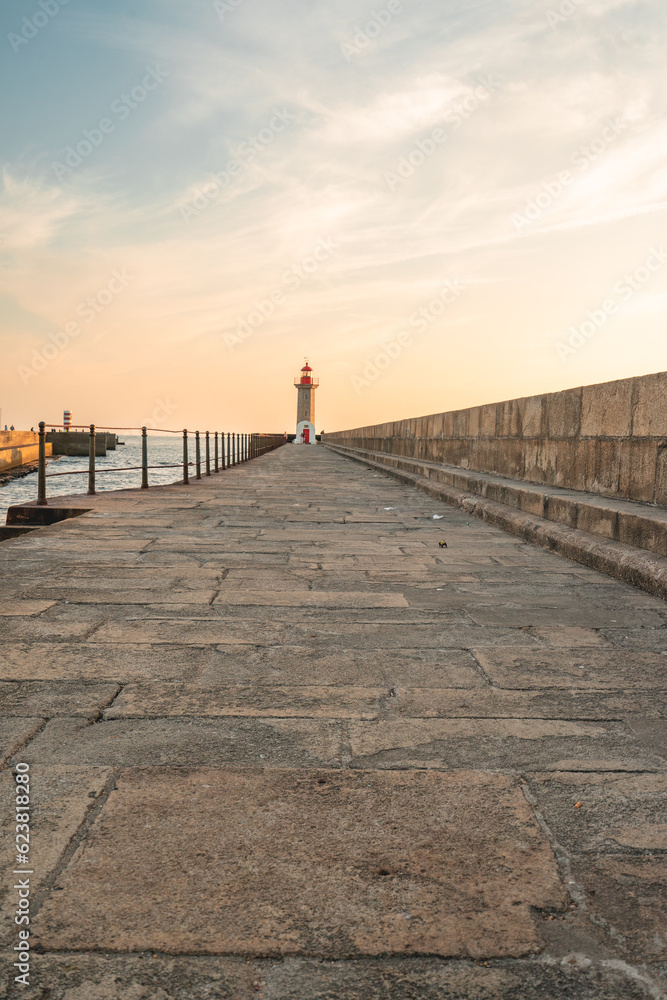 Farolim de Felgueiras, Pier and lighthouse at Porto, Portugal During sunset.