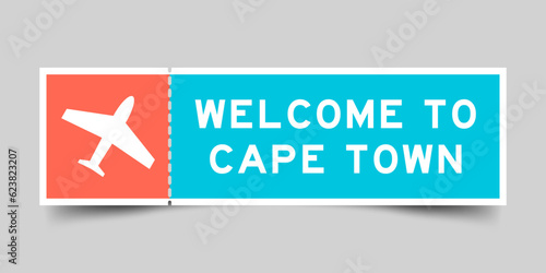 Orange and blue color ticket with plane icon and word welcome to cape town on gray background