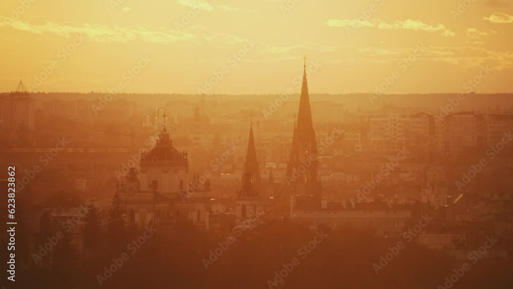 Perfect city view from the hill. Sunrise time. View of churches and residential part. Combination of ancient and new parts of the city. Perfect city view from the hill. Sunrise time. View of churches and residential part. Combination of ancient and new parts of the city.