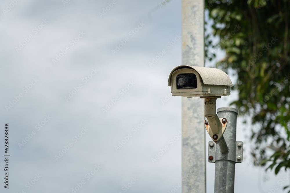 The CCTV security camera which is installed on metal post for exterior monitoring.