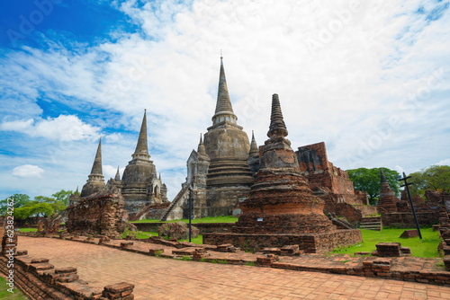 Three pagodas in an ancient Buddhist temple called Wat Prasrisanpetch in Ayutthaya historical park under noon sun light, public domain
