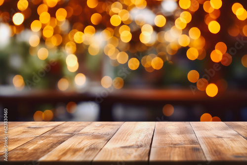 Fotografiet Image of wooden table in front of abstract blurred restaurant lights background