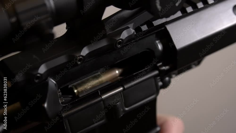 AR-15 rifle. Installing the magazine and sending the cartridge into the chamber of the rifle AR-15 rifle. Installing the magazine and sending the cartridge into the chamber of the rifle