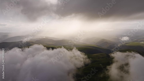 Wallpaper Mural Aerial view timelapse of parallax clouds over a mountainous area. Videos summer mountain background Torontodigital.ca