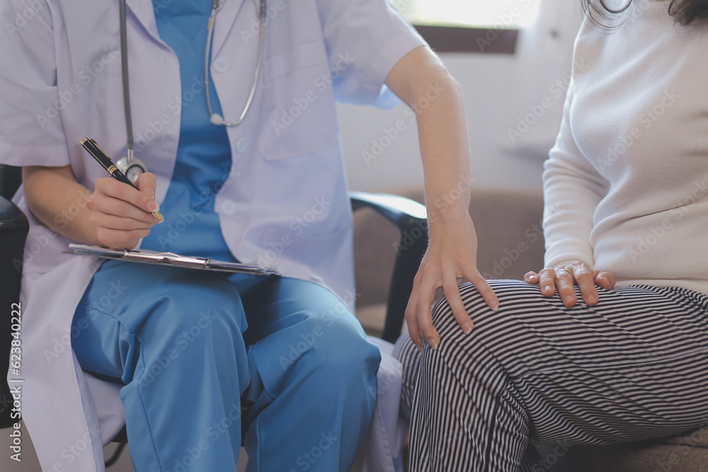 Fototapeta premium Asian doctor woman visited patient woman to diagnosis and check up health at home or private hospital. Female patient explain health problem and symptoms to doctor .Health care premium service at home