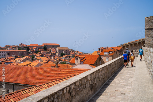 Family walking the city wall in Dubrovnik, Croatia photo