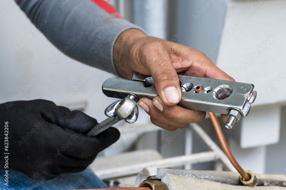 Close up air condition man with copper pipe measurement tool , Air Condition Installation Close up air condition man with copper pipe measurement tool , Air Condition Installation
