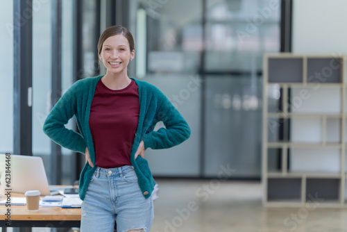 Sharing good business news. Attractive young businesswoman talking on the mobile phone and smiling while sitting at her working place in office and looking at laptop PC Free Download Sharing good business news. Attractive young businesswoman talking on the mobile phone and smiling while sitting at her working place in office and looking at laptop PC - GFXLoad