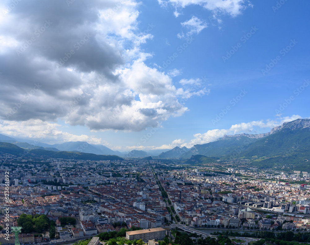 View on central part of Grenoble city from Bastille fortres witn mountains around, old cable car, Isere, France