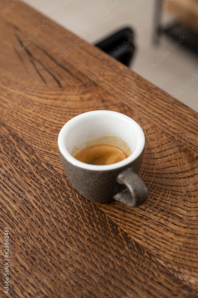 espresso in a gray ceramic cup on a wooden table. espresso. coffee. black coffee. coffee espresso espresso in a gray ceramic cup on a wooden table. espresso. coffee. black coffee. coffee espresso