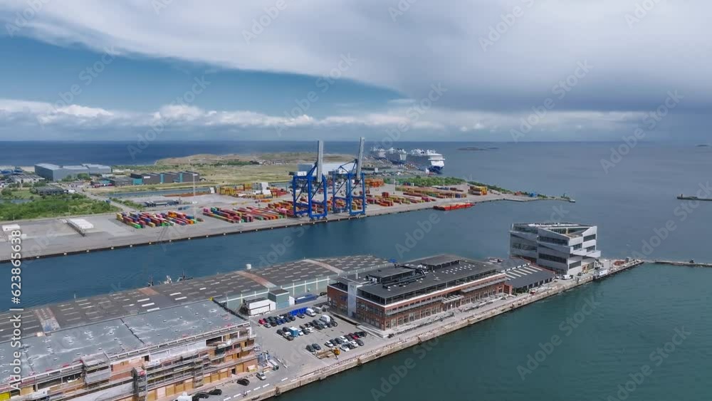 Conteiner docks in Copenhagen, Denmark. Large container cranes at a shipping terminal in the port of Copenhagen. Aerial panoramic view. Conteiner docks in Copenhagen, Denmark. Large container cranes at a shipping terminal in the port of Copenhagen. Aerial panoramic view.