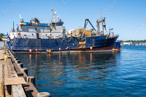 Картината върху платно Industrial fishery: factory fishing vessel idle at dock in ballard seatle washington in summer