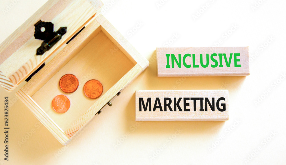 Inclusive marketing symbol. Concept words Inclusive marketing on wooden blocks. Beautiful white table white background. Wooden chest with coins. Business inclusive marketing concept. Copy space. Inclusive marketing symbol. Concept words Inclusive marketing on wooden blocks. Beautiful white table white background. Wooden chest with coins. Business inclusive marketing concept. Copy space.