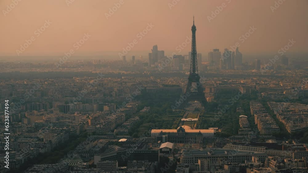 The Eiffel Tower and skyscrapers of La Defense business district withic cityscape of Paris in the evening. France The Eiffel Tower and skyscrapers of La Defense business district withic cityscape of Paris in the evening. France