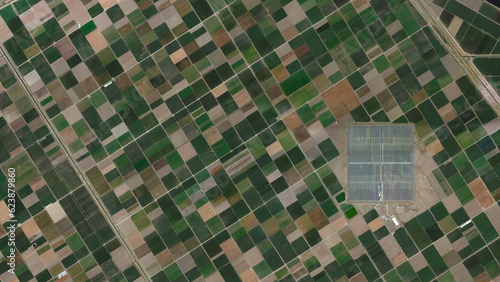 colorful fields and solar power plant bird's eye view, land consolidation and cultivated fields looking down aerial view from above Lebrija, Spain photo
